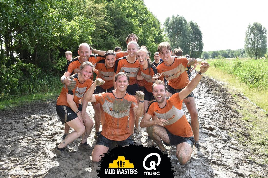 HotelSpecials team in orange shirts at Mud Masters