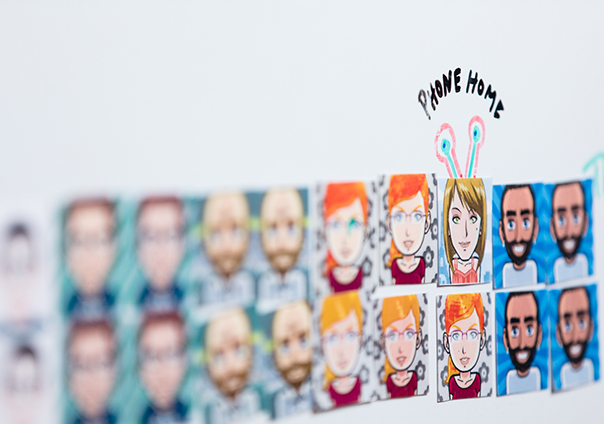 Our team drawn as avatars on the office wall